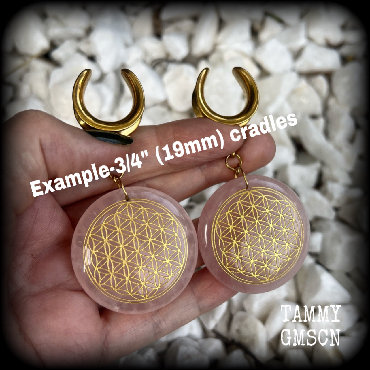 These gorgeous ear hangers feature beautiful rose quartz gemstones etched with the flower of life, measuring just over 8cms from tip to tip, and weighing approx 32 grams each.

This pair has been made on 3/4" gauge (19mm) surgical steel cradles, to be worn in stretched lobes.