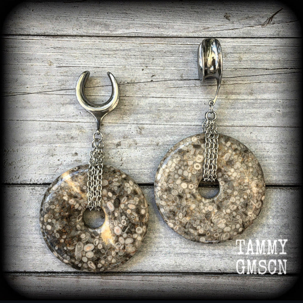 These are gorgeous one of a kind Crinoid Fossil ear weights, weighing in at approx 40 grams each, and measuring just on 9 cms from tip to tip.
This pair has been made with 5/8" gauge (16mm) surgical steel cradles, suitable for stretched lobes.