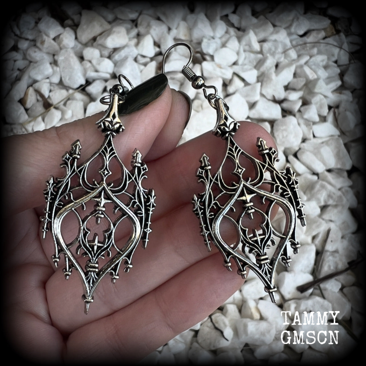 These gorgeous gothic earrings feature a beautiful antique silver ornate gothic cathedral architectural arch, measuring just on 7cms from tip to tip, and weighing approx 7 grams each.

This pair has been made with stainless steel hooks, for pierced ears.