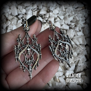 These gorgeous gothic earrings feature a beautiful antique silver ornate gothic cathedral architectural arch, measuring just on 7cms from tip to tip, and weighing approx 7 grams each.

This pair has been made with stainless steel hooks, for pierced ears.