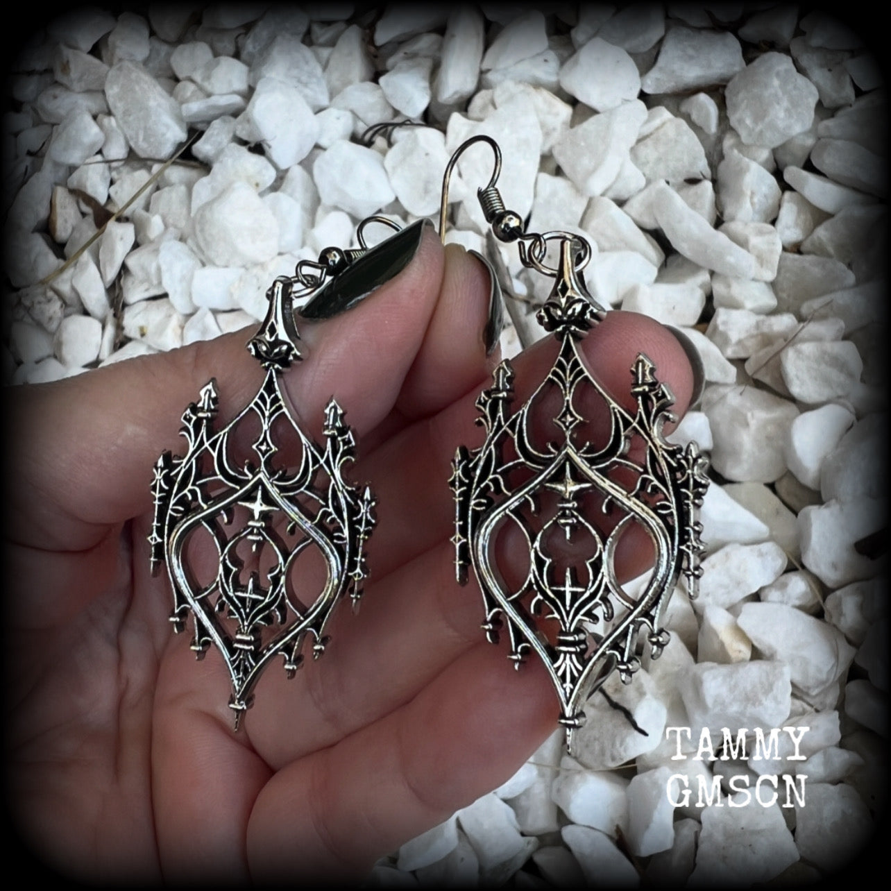 These gorgeous gothic earrings feature a beautiful antique silver ornate gothic cathedral architectural arch, measuring just on 7cms from tip to tip, and weighing approx 7 grams each.

This pair has been made with stainless steel hooks, for pierced ears.