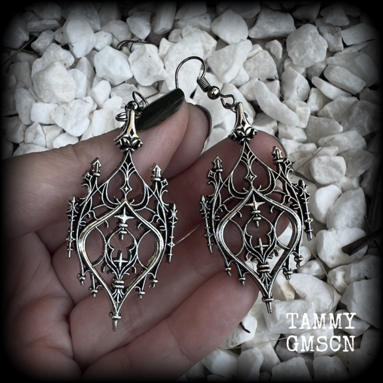 These gorgeous gothic earrings feature a beautiful antique silver ornate gothic cathedral architectural arch, measuring just on 7cms from tip to tip, and weighing approx 7 grams each.

This pair has been made with stainless steel hooks, for pierced ears.