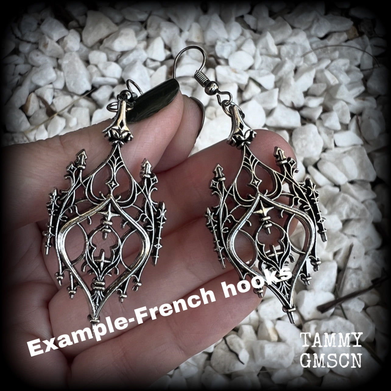 These gorgeous gothic earrings feature a beautiful antique silver ornate gothic cathedral architectural arch, measuring just on 7cms from tip to tip, and weighing approx 7 grams each.

This pair has been made with stainless steel hooks, for pierced ears.