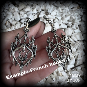 These gorgeous gothic earrings feature a beautiful antique silver ornate gothic cathedral architectural arch, measuring just on 7cms from tip to tip, and weighing approx 7 grams each.

This pair has been made with stainless steel hooks, for pierced ears.