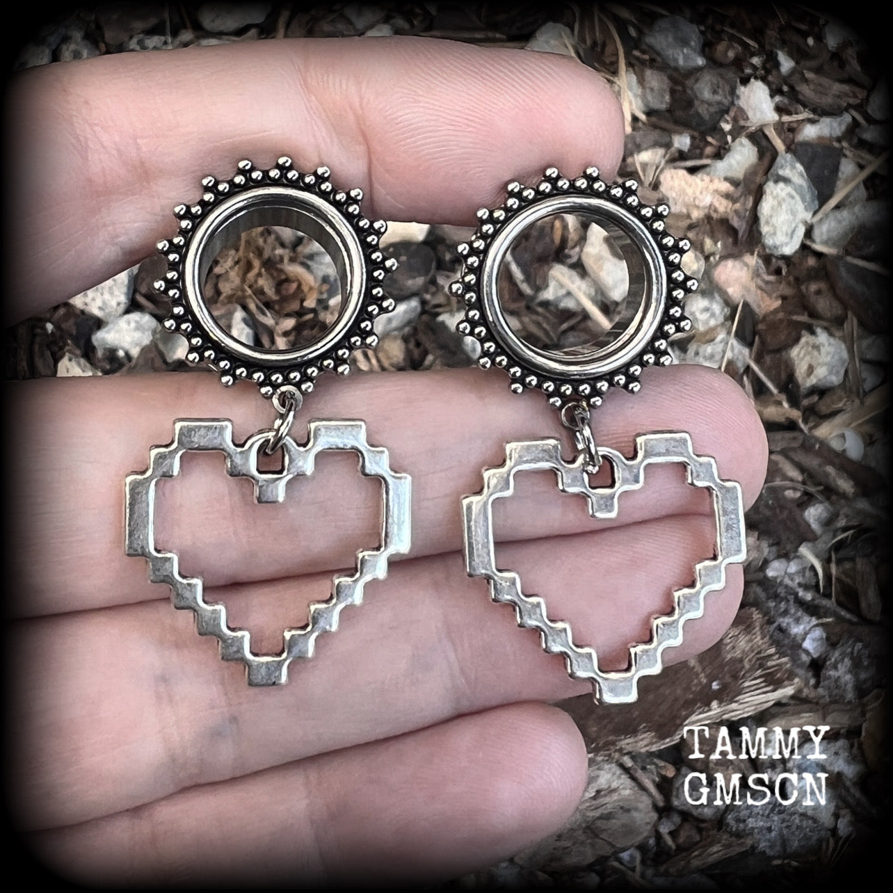 Featuring super retro antique silver pixel hearts, these tunnel earrings measure 4.5cm from tip to tip, and weigh approx 8 grams each.

This pair has been made on 9/16" (14mm) ornate surgical steel tunnels, suitable for stretched lobes.