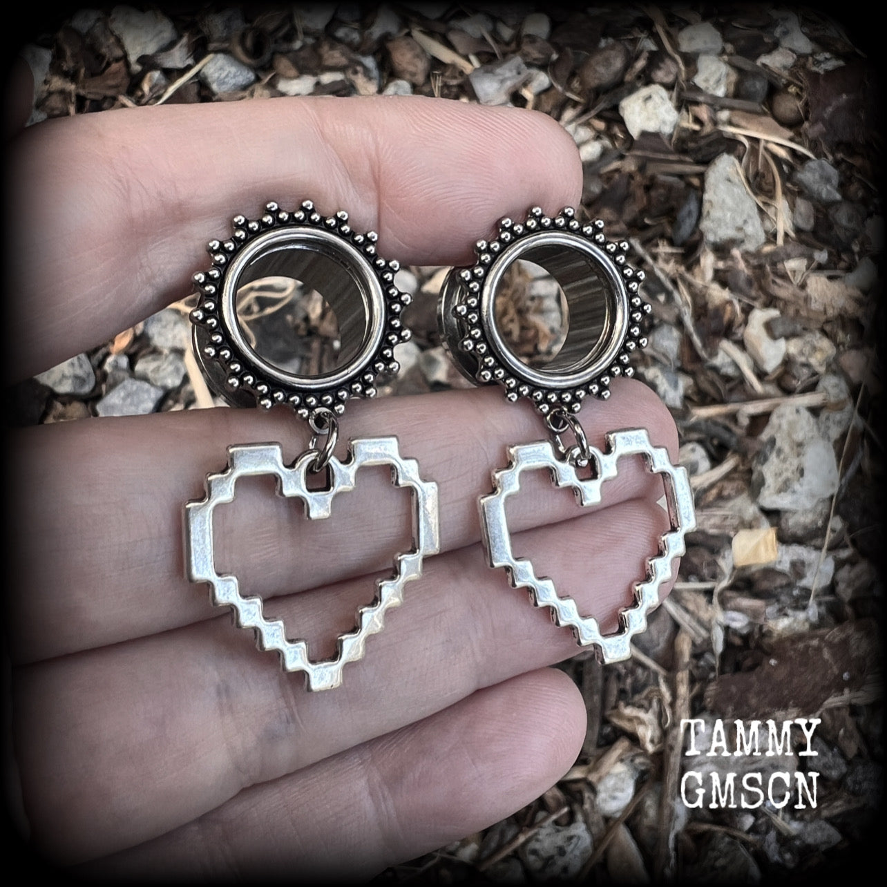 Featuring super retro antique silver pixel hearts, these tunnel earrings measure 4.5cm from tip to tip, and weigh approx 8 grams each.

This pair has been made on 9/16" (14mm) ornate surgical steel tunnels, suitable for stretched lobes.