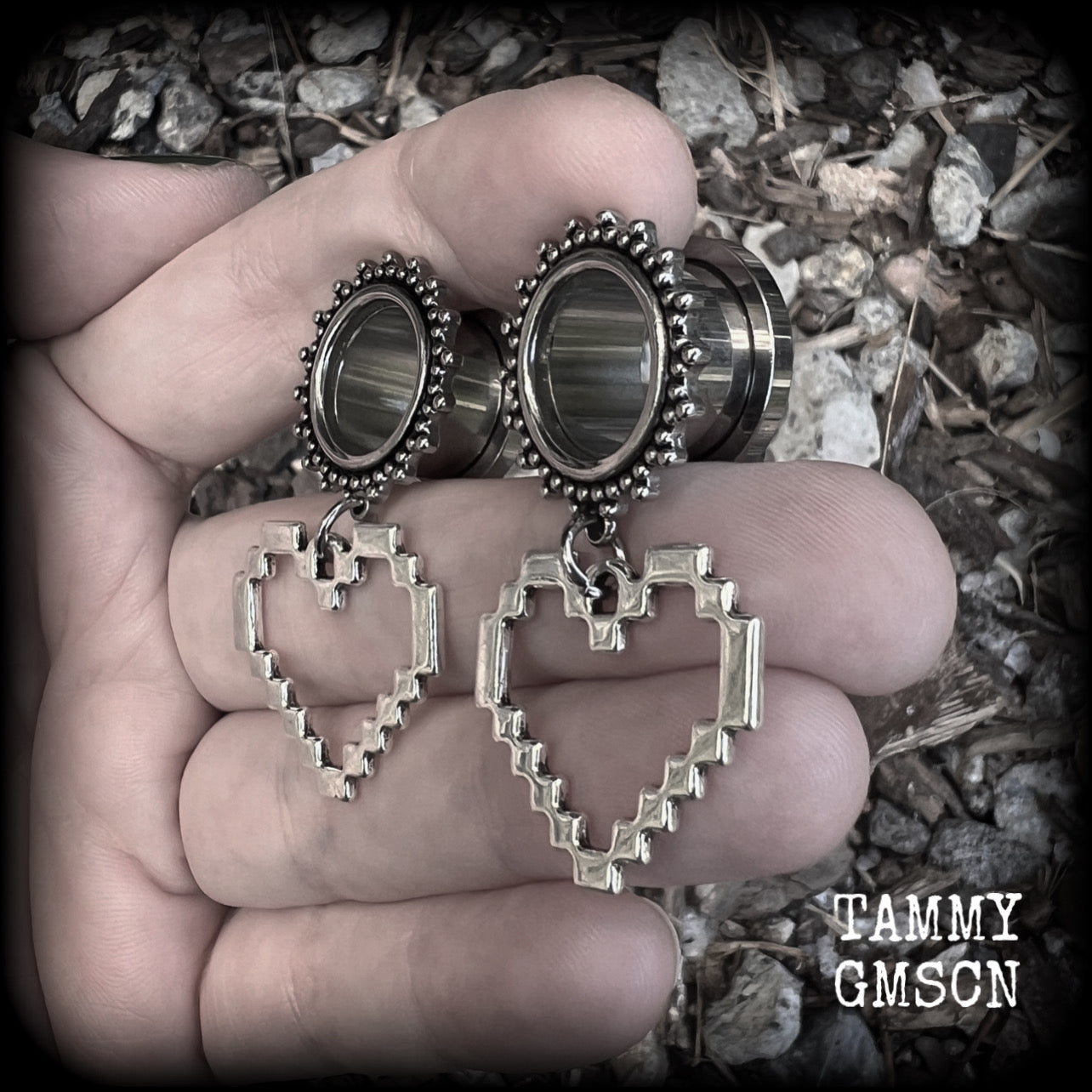 Featuring super retro antique silver pixel hearts, these tunnel earrings measure 4.5cm from tip to tip, and weigh approx 8 grams each.

This pair has been made on 9/16" (14mm) ornate surgical steel tunnels, suitable for stretched lobes.