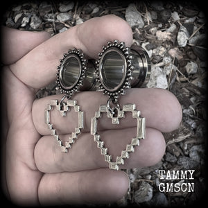 Featuring super retro antique silver pixel hearts, these tunnel earrings measure 4.5cm from tip to tip, and weigh approx 8 grams each.

This pair has been made on 9/16" (14mm) ornate surgical steel tunnels, suitable for stretched lobes.