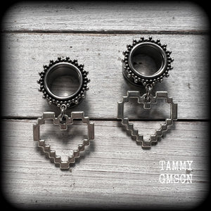 Featuring super retro antique silver pixel hearts, these tunnel earrings measure 4.5cm from tip to tip, and weigh approx 8 grams each.

This pair has been made on 9/16" (14mm) ornate surgical steel tunnels, suitable for stretched lobes.