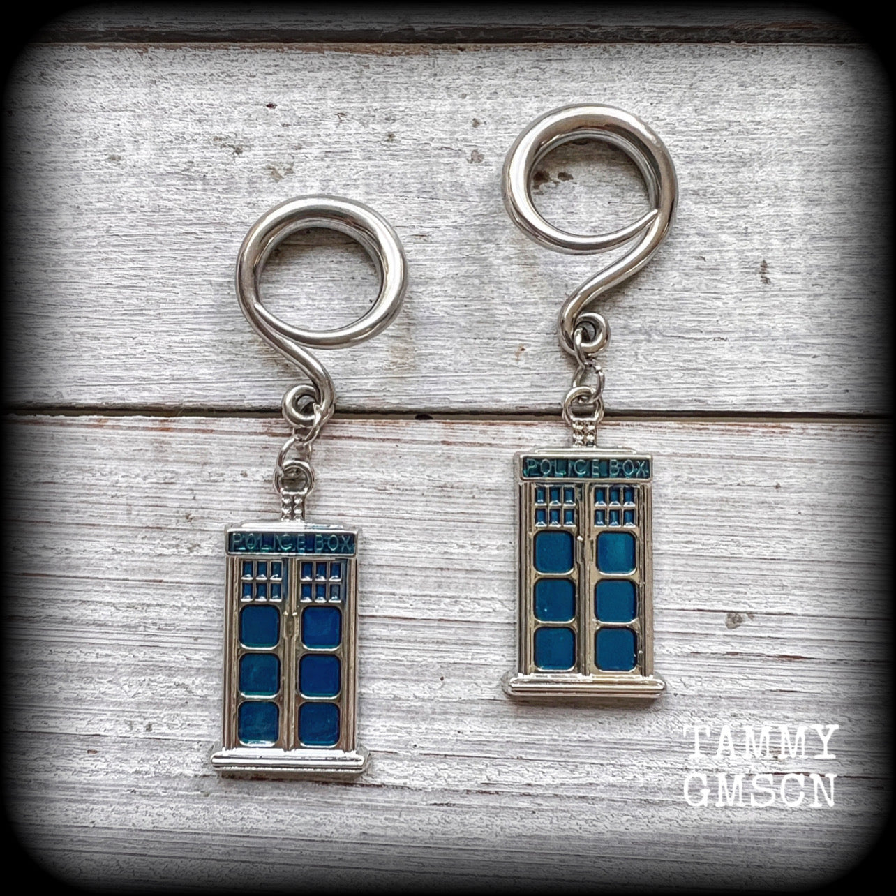 These super rad Dr Who Tardis earrings feature classic antique silver and blue enamel charms, measuring 6 cms from tip to tip, weighing in at only 8 grams each.


This pair has been made on 6 gauge (4mm) surgical steel full curl hooks, suitable for stretched lobes.