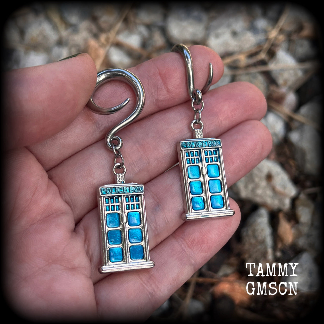 These super rad Dr Who Tardis earrings feature classic antique silver and blue enamel charms, measuring 6 cms from tip to tip, weighing in at only 8 grams each.


This pair has been made on 6 gauge (4mm) surgical steel full curl hooks, suitable for stretched lobes.