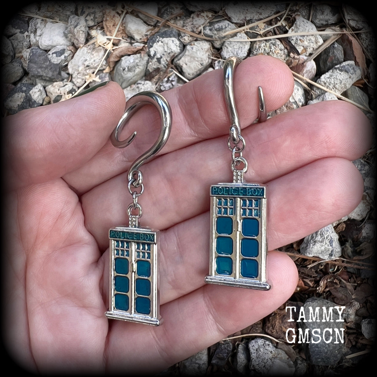 These super rad Dr Who Tardis earrings feature classic antique silver and blue enamel charms, measuring 6 cms from tip to tip, weighing in at only 8 grams each.


This pair has been made on 6 gauge (4mm) surgical steel full curl hooks, suitable for stretched lobes.