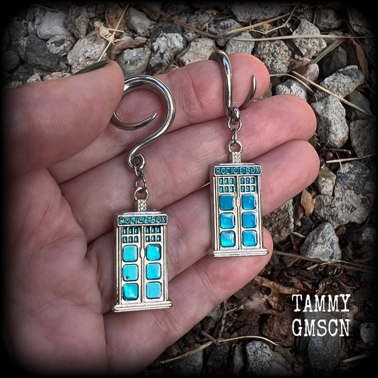 These super rad Dr Who Tardis earrings feature classic antique silver and blue enamel charms, measuring 6 cms from tip to tip, weighing in at only 8 grams each.


This pair has been made on 6 gauge (4mm) surgical steel full curl hooks, suitable for stretched lobes.
