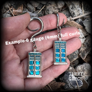 These super rad Dr Who Tardis earrings feature classic antique silver and blue enamel charms, measuring 6 cms from tip to tip, weighing in at only 8 grams each.


This pair has been made on 6 gauge (4mm) surgical steel full curl hooks, suitable for stretched lobes.