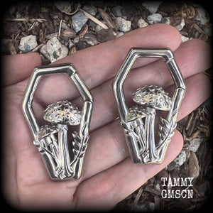 Featuring gorgeous surgical steel mushrooms enclosed in a coffin shaped frame, these earrings measure 5cms from tip to tip, and weigh approx 29 grams each.