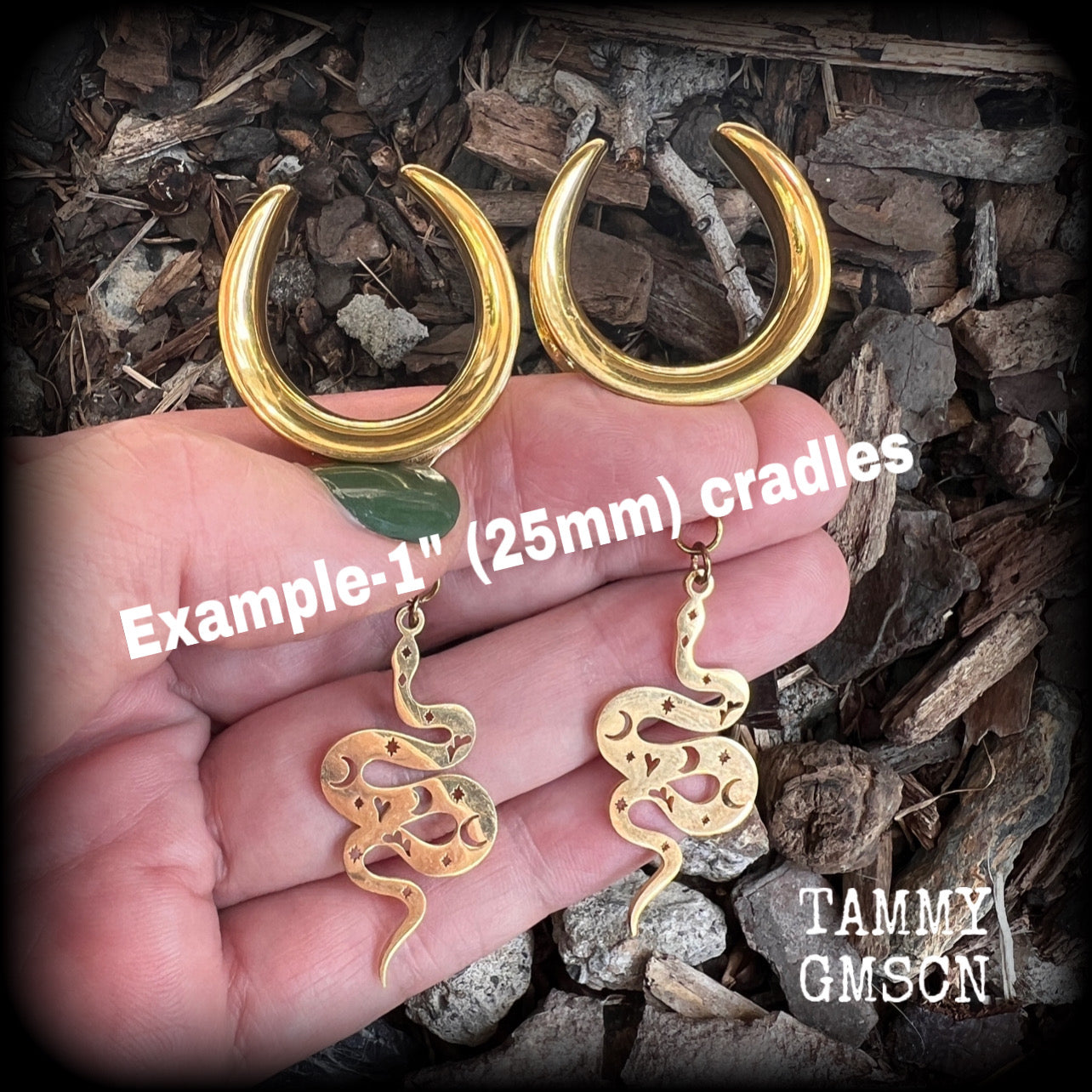 Inspired by the Voodoo Sky-father Damballah, these gorgeous earrings feature gold stainless steel celestial serpents, super lightweight at only a few grams a piece, and mesure just on 6.5cms from tip to tip.
These earrings have been made on 1” gauge surgical steel cradles, suitable for stretched lobes.