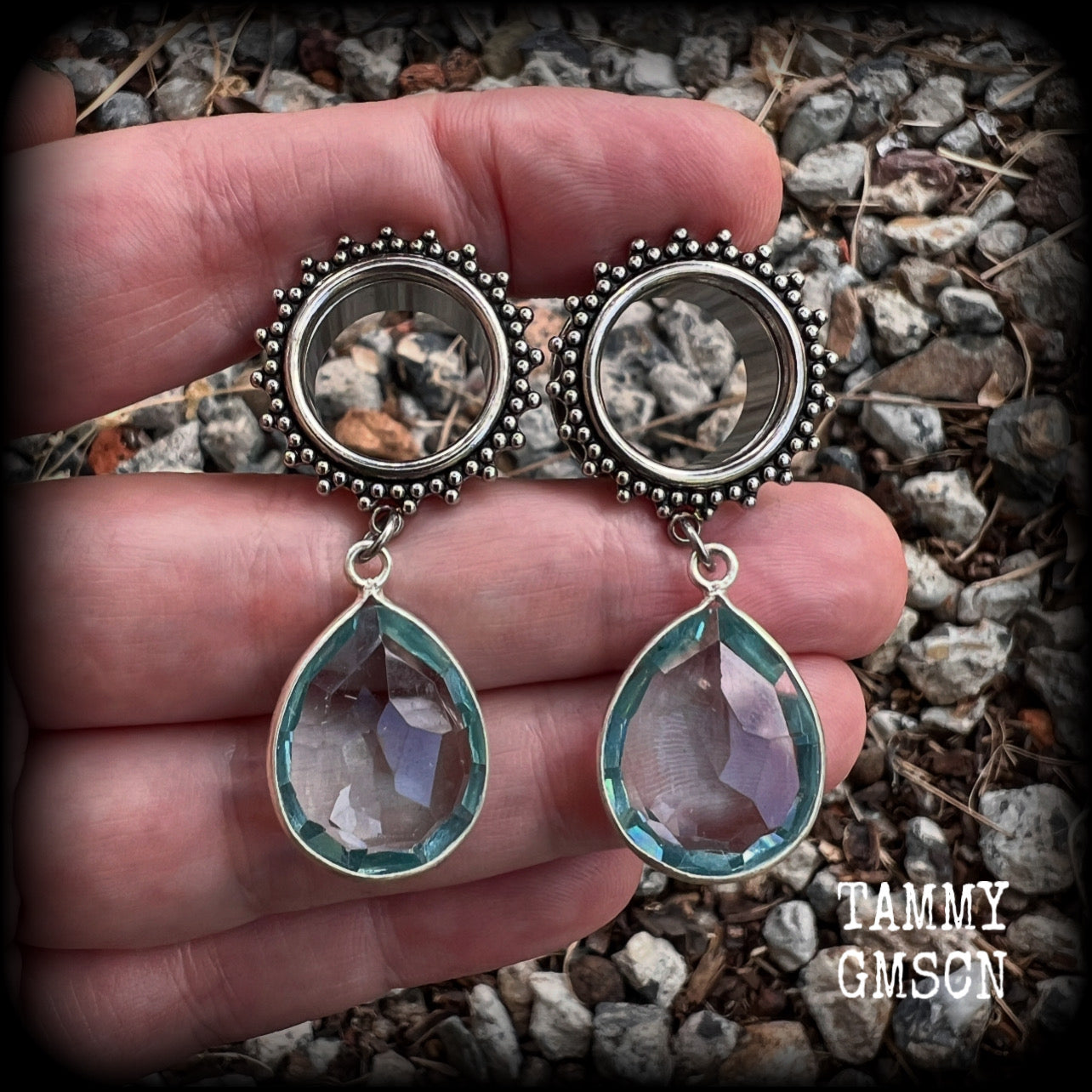 These gorgeous tunnel dangles feature beautiful blue topaz gemstones set in antique silver, weighing approx 16 grams each and measuring just over 5cms from tip to tip.
This pair has been made with 5/8 gauge (16mm) surgical steel ornate tunnels.