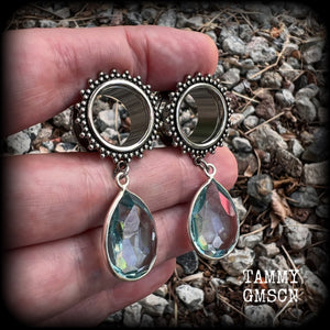 These gorgeous tunnel dangles feature beautiful blue topaz gemstones set in antique silver, weighing approx 16 grams each and measuring just over 5cms from tip to tip.
This pair has been made with 5/8 gauge (16mm) surgical steel ornate tunnels.