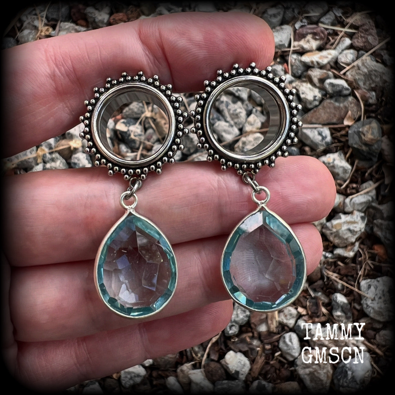 These gorgeous tunnel dangles feature beautiful blue topaz gemstones set in antique silver, weighing approx 16 grams each and measuring just over 5cms from tip to tip.
This pair has been made with 5/8 gauge (16mm) surgical steel ornate tunnels.