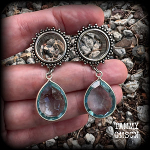 These gorgeous tunnel dangles feature beautiful blue topaz gemstones set in antique silver, weighing approx 16 grams each and measuring just over 5cms from tip to tip.
This pair has been made with 5/8 gauge (16mm) surgical steel ornate tunnels.