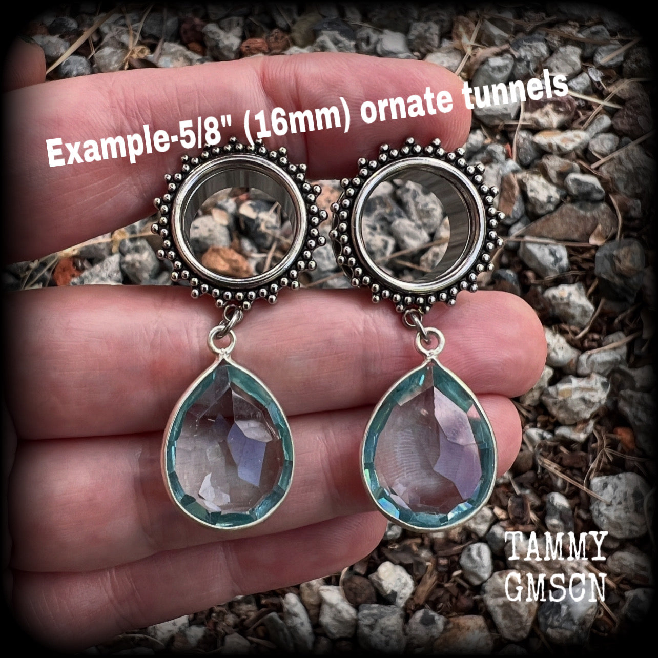 These gorgeous tunnel dangles feature beautiful blue topaz gemstones set in antique silver, weighing approx 16 grams each and measuring just over 5cms from tip to tip.
This pair has been made with 5/8 gauge (16mm) surgical steel ornate tunnels.