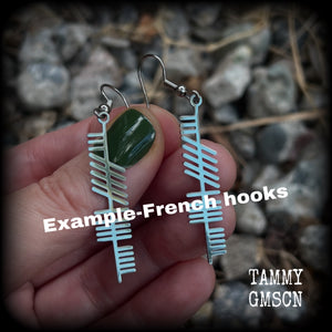 These beautiful Ogham alphabet earrings feature a stainless steel Ogham stave, spelling out the word 'strength'.
These are nice and light weight, weighing only a few grams each, and nice and dangly, measuring just on 6cms from tip to tip.
