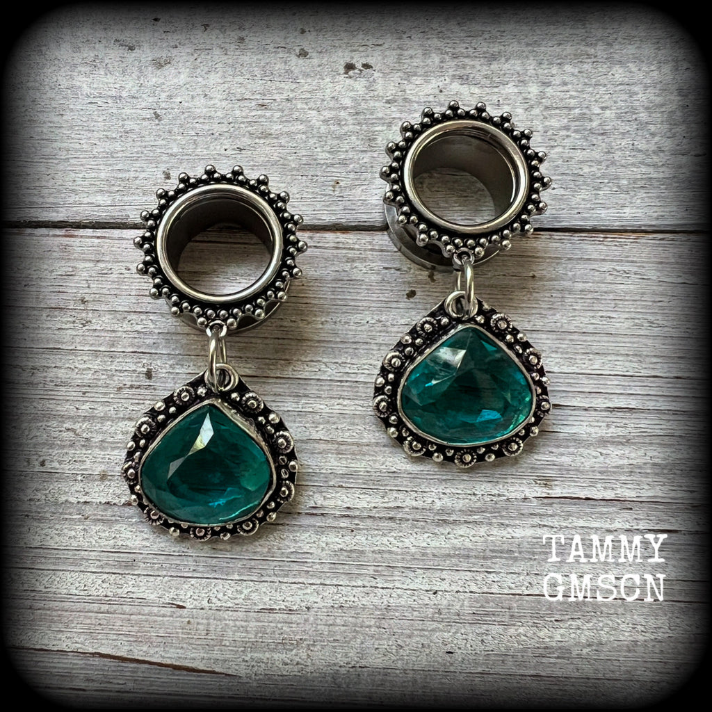 These gorgeous boho tunnel earrings have been made with beautiful ocean blue gemstones in an antique silver setting, are light weight-weighing approx 10 grams each and measure just on 5 cms from tip to tip.
These tunnel dangles have been made with 9/16” gauge (14mm) ornate surgical steel screw fit tunnels.
