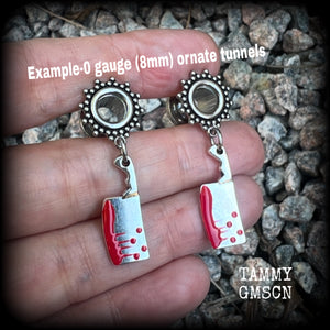 Featuring classic b l o o d i e d antique silver meat cleavers, these horror punk inspired gauged earrings weigh in at only 5 grams a piece, and measure 4cms from tip to tip.

This pair has been made on 0 gauge (8mm) surgical steel screw fit ornate tunnels, to be worn in stretched lobes.