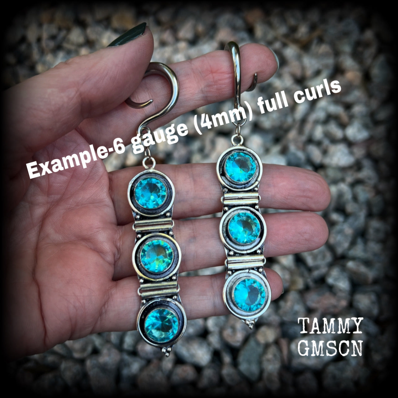 These earrings have been made with gorgeous facet ocean blue topaz gemstones in a beautifully boho antique silver setting, lovely and dangly at approx 9.5cms from tip to tip, and not too heavy at only 11 grams each.

These earrings have been made on 6 gauge (4mm) surgical steel full curl hooks, to be worn in stretched lobes.