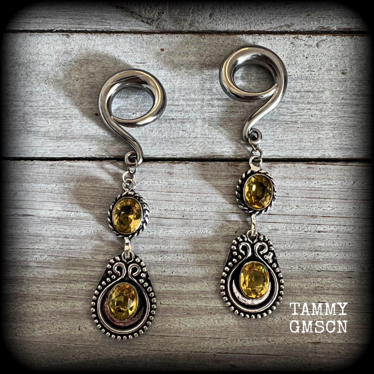 These beautiful boho gauged earrings have been made with gorgeous yellow citrine gemstones, lovely and dangly at just over 8cms from tip to tip, and weighing approx 14 grams each.

These earrings have been made on 2 gauge (6mm) surgical steel full curl hooks, to be worn in stretched lobes.