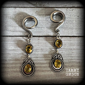 These beautiful boho gauged earrings have been made with gorgeous yellow citrine gemstones, lovely and dangly at just over 8cms from tip to tip, and weighing approx 14 grams each.

These earrings have been made on 2 gauge (6mm) surgical steel full curl hooks, to be worn in stretched lobes.