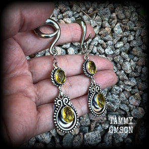 These beautiful boho gauged earrings have been made with gorgeous yellow citrine gemstones, lovely and dangly at just over 8cms from tip to tip, and weighing approx 14 grams each.

These earrings have been made on 2 gauge (6mm) surgical steel full curl hooks, to be worn in stretched lobes.