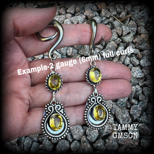 These beautiful boho gauged earrings have been made with gorgeous yellow citrine gemstones, lovely and dangly at just over 8cms from tip to tip, and weighing approx 14 grams each.

These earrings have been made on 2 gauge (6mm) surgical steel full curl hooks, to be worn in stretched lobes.