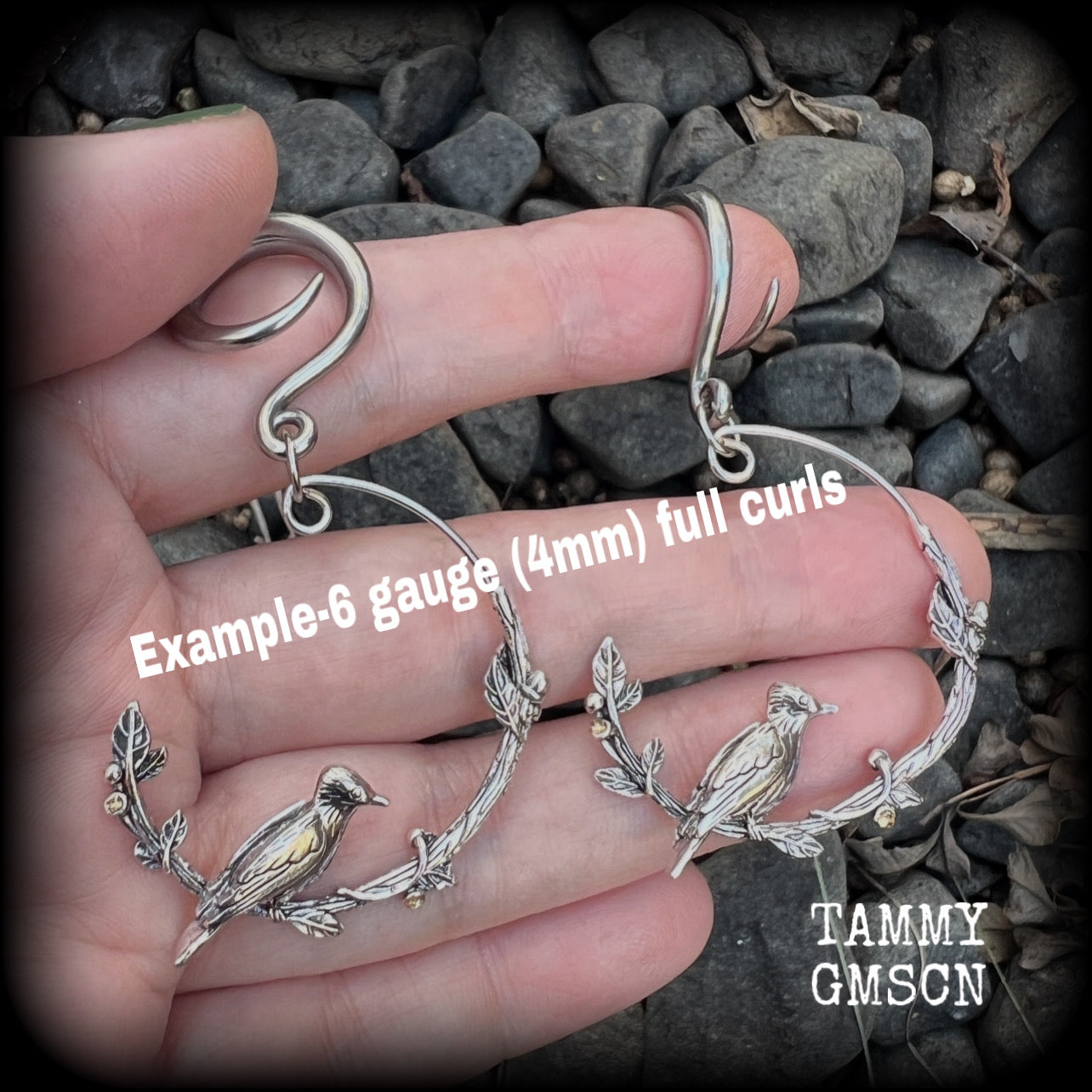 Featuring a gorgeous antique silver bird sitting on a branch wrapped with beautiful leafy vines, these delicate earrings measure just on 6.5 cms from tip to tip, and weigh approx 8 grams.
This pair have been made on 6 gauge (4mm) stainless steel full curl hooks, suitable for stretched lobes.