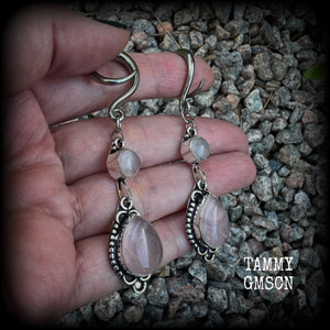 These beautiful boho earrings feature gorgeous polished dusty pink rose quartz gemstones, lovely and dangly measuring just over 7cms from tip to tip, and weighing approx 9 grams each. 

These earrings have been made on 6 gauge (4mm) stainless steel full curl hooks, to be worn in stretched lobes.
