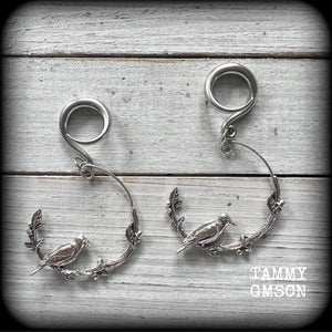 Featuring a gorgeous antique silver bird sitting on a branch wrapped with beautiful leafy vines, these delicate earrings measure  6.5 cms from tip to tip, and weigh 8 grams.
This pair have been made on 6 gauge (4mm) surgical steel full curl hooks.