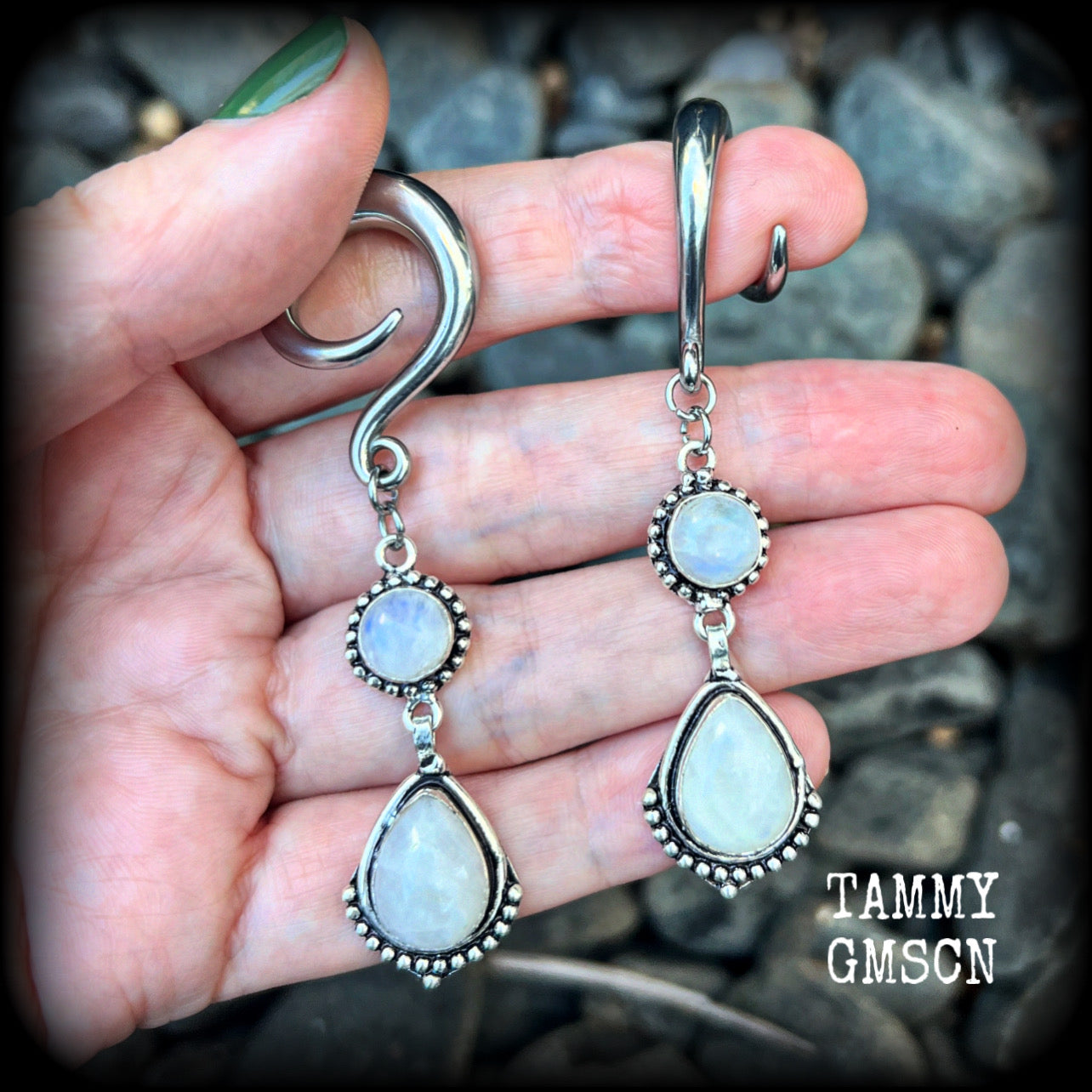 These gorgeous earrings feature polished Rainbow Moonstone gemstones in a beautiful boho antique silver setting, lovely and dangly at approx 7.5cms, and not too heavy at 13 grams each
This pair had been made on 2 gauge (6mm) surgical steel full curls