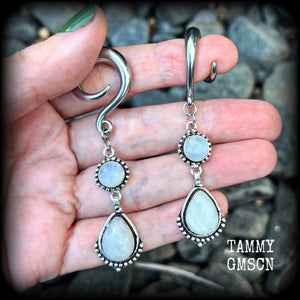 These gorgeous earrings feature polished Rainbow Moonstone gemstones in a beautiful boho antique silver setting, lovely and dangly at approx 7.5cms, and not too heavy at 13 grams each
This pair had been made on 2 gauge (6mm) surgical steel full curls