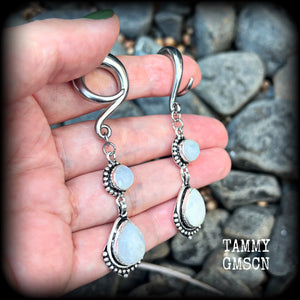 These gorgeous earrings feature polished Rainbow Moonstone gemstones in a beautiful boho antique silver setting, lovely and dangly at approx 7.5cms, and not too heavy at 13 grams each
This pair had been made on 2 gauge (6mm) surgical steel full curls