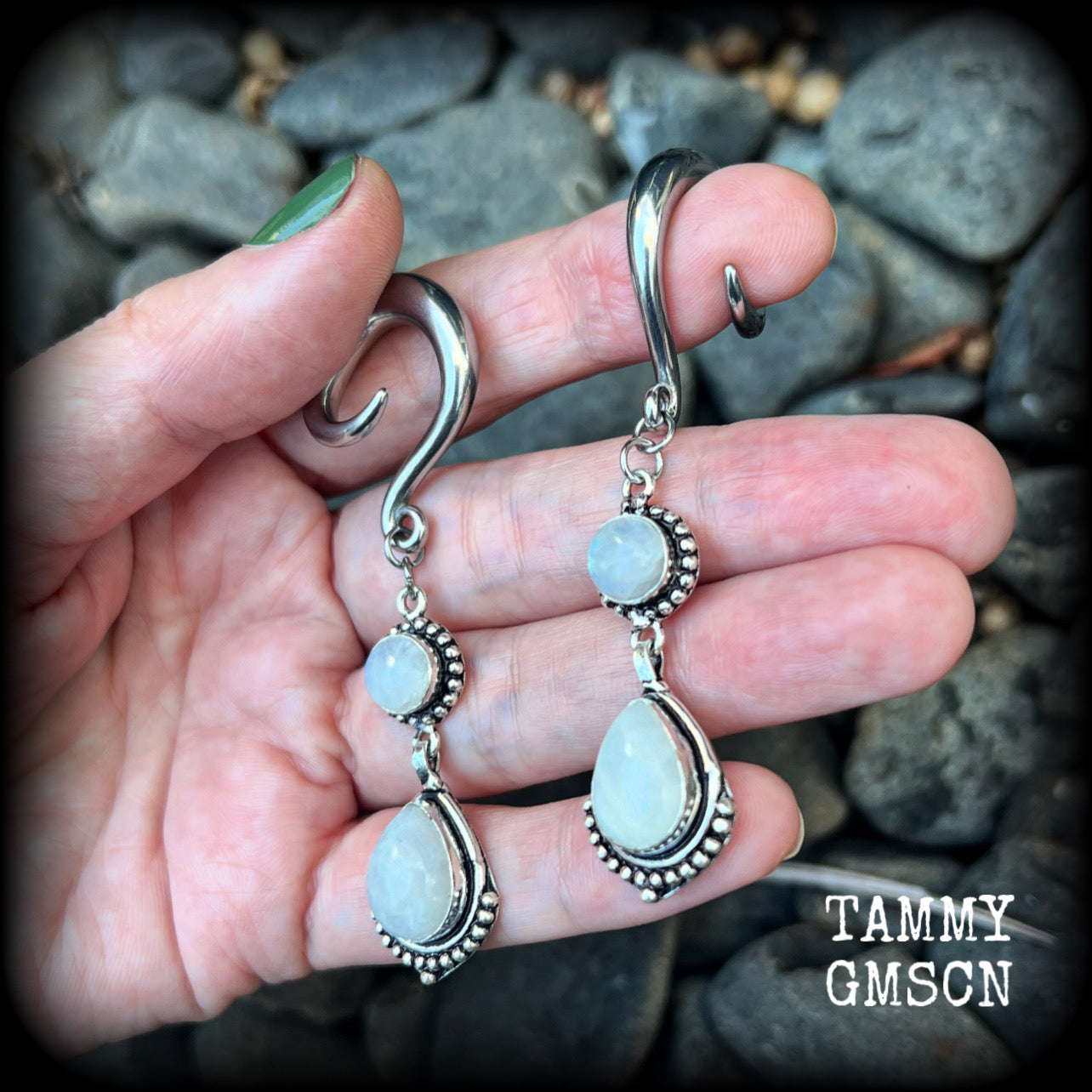 These gorgeous earrings feature polished Rainbow Moonstone gemstones in a beautiful boho antique silver setting, lovely and dangly at approx 7.5cms, and not too heavy at 13 grams each
This pair had been made on 2 gauge (6mm) surgical steel full curls
