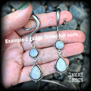 These gorgeous earrings feature polished Rainbow Moonstone gemstones in a beautiful boho antique silver setting, lovely and dangly at approx 7.5cms, and not too heavy at 13 grams each
This pair had been made on 2 gauge (6mm) surgical steel full curls