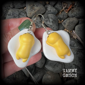 These earrings are TOO CUTE!!! Featuring the adorable Gudetama lazy egg man himself laying on a bed of egg whites, these earrings measure just on 6cms and weigh approx 8 grams.
This pair has been made on stainless steel french hooks, suitable for pierced ears.