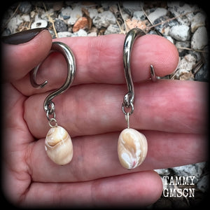 These gorgeous gauged earrings feature beautiful polished sea shell nuggets, weighing in at just 5 grams a piece, and measuring approx 5.5cms from tip to tip.
This pair has been made on 6 gauge (4mm) surgical steel full curl hooks