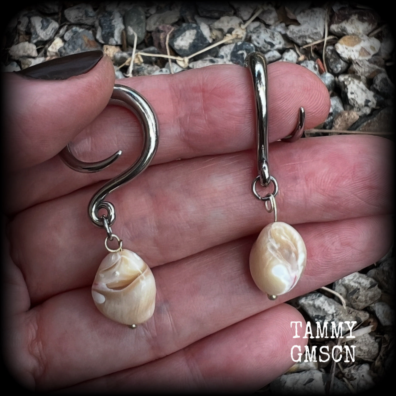 These gorgeous gauged earrings feature beautiful polished sea shell nuggets, weighing in at just 5 grams a piece, and measuring approx 5.5cms from tip to tip.
This pair has been made on 6 gauge (4mm) surgical steel full curl hooks
