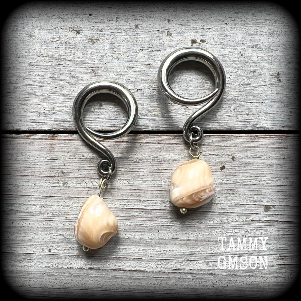 These gorgeous gauged earrings feature beautiful polished sea shell nuggets, weighing in at just 5 grams a piece, and measuring approx 5.5cms from tip to tip.
This pair has been made on 6 gauge (4mm) surgical steel full curl hooks