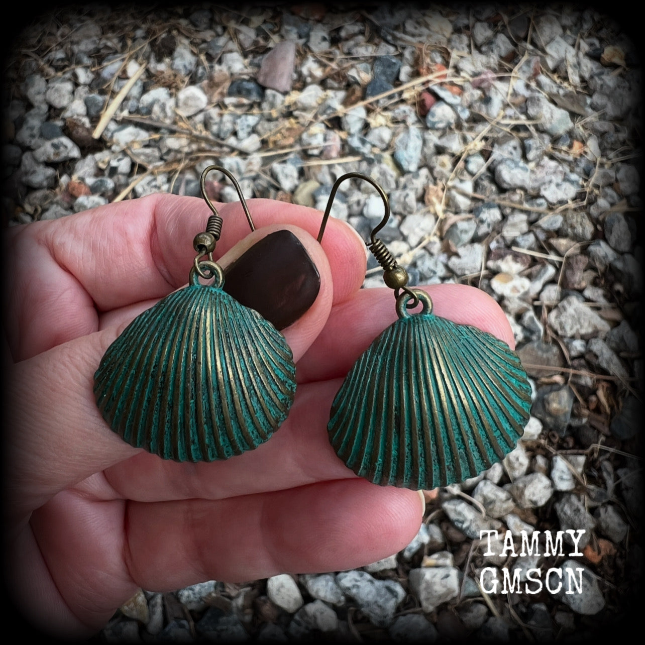 This is a simpler pair of earrings from our Sea Hag range, featuring a single gorgeous verdigris patina charm shell, measuring just on 4.5cms from tip to tip and weighing around 4 grams each.
This pair has been made with antique bronze french hooks, for pierced ears.