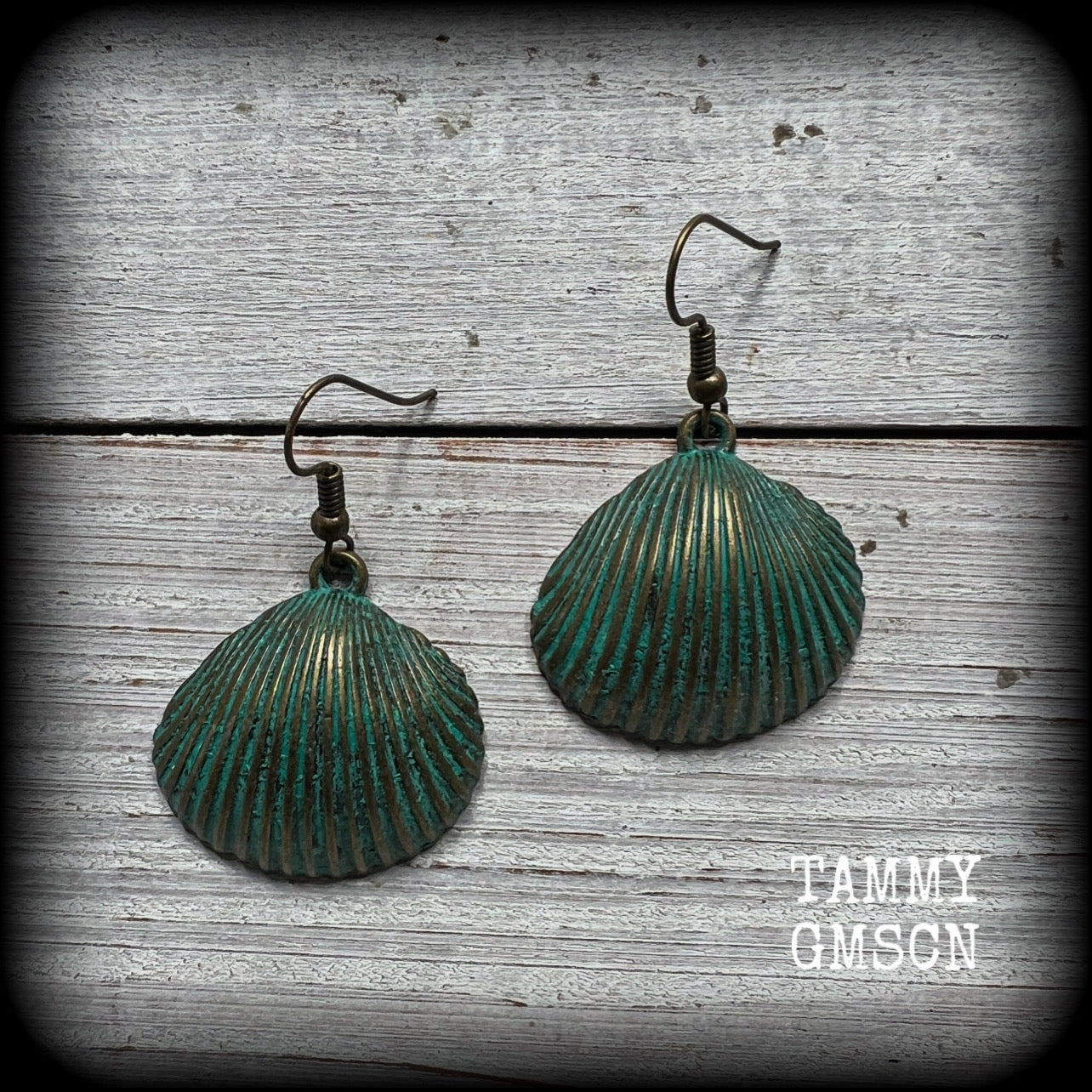 This is a simpler pair of earrings from our Sea Hag range, featuring a single gorgeous verdigris patina charm shell, measuring just on 4.5cms from tip to tip and weighing around 4 grams each.
This pair has been made with antique bronze french hooks, for pierced ears.