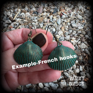This is a simpler pair of earrings from our Sea Hag range, featuring a single gorgeous verdigris patina charm shell, measuring just on 4.5cms from tip to tip and weighing around 4 grams each.
This pair has been made with antique bronze french hooks, for pierced ears.