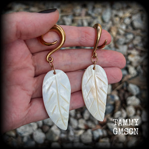 Featuring beautiful milky white carved shell leaves, these earrings are simply beautiful, measuring just over 8 cms from tip to tip, and are not too heavy at only 13 grams each.
This pair has been made on 2 gauge (6mm) surgical steel full curl hooks, suitable for stretched lobes.
