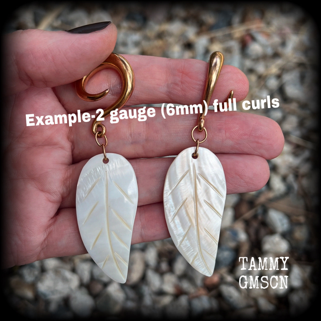 Featuring beautiful milky white carved shell leaves, these earrings are simply beautiful, measuring just over 8 cms from tip to tip, and are not too heavy at only 13 grams each.
This pair has been made on 2 gauge (6mm) surgical steel full curl hooks, suitable for stretched lobes.
